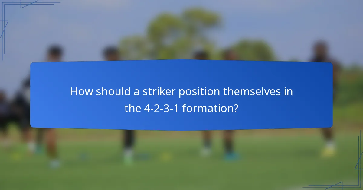 How should a striker position themselves in the 4-2-3-1 formation?